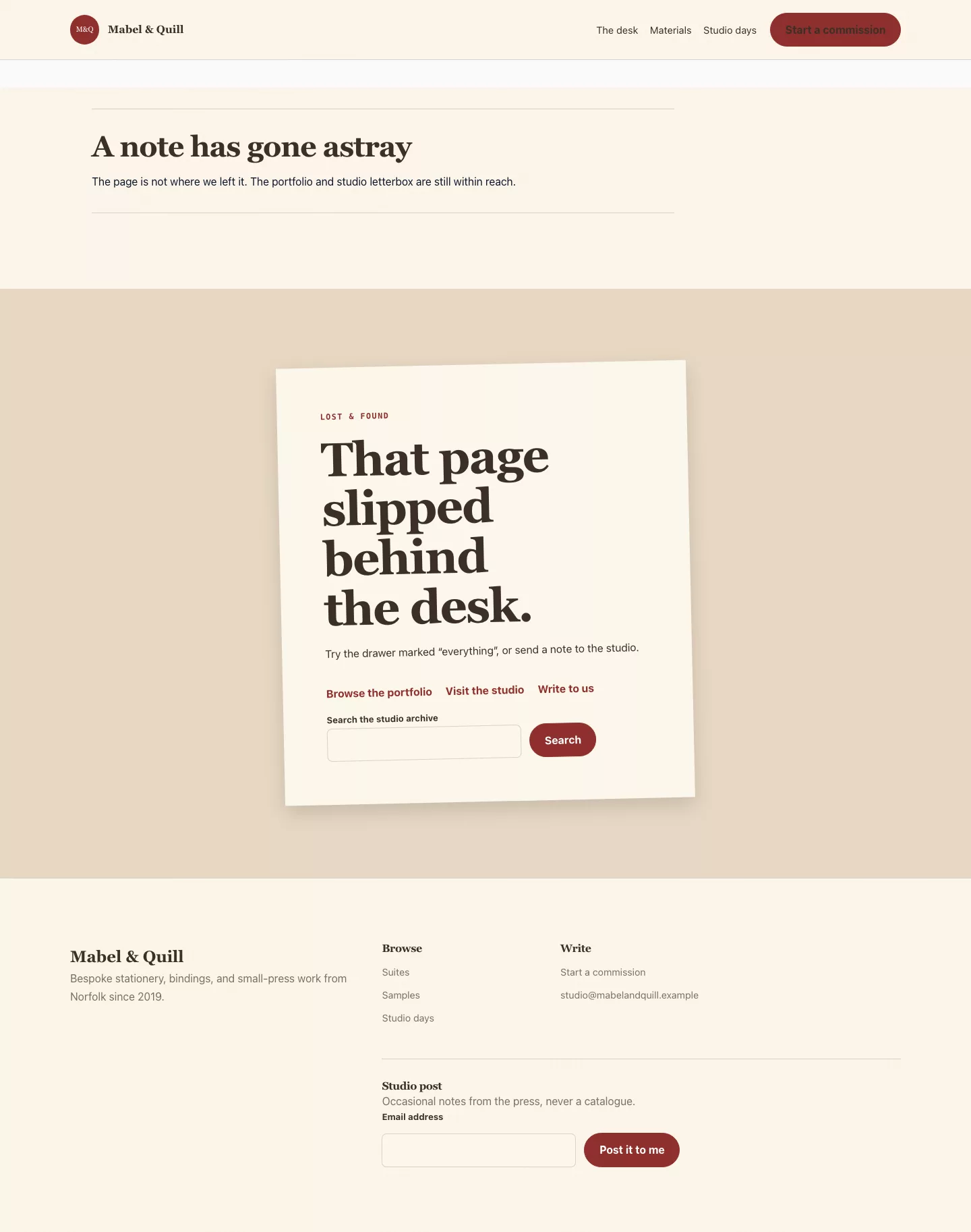 Paperdesk not-found page with a note slipped behind the desk